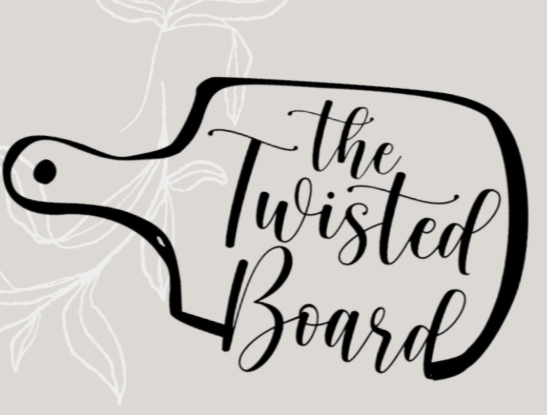 A black outline of a cutting board with the words "the Twisted Board" written in elegant script inside, over a light background with faint botanical illustrations.
